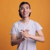 young-cheerful-smiling-asian-man-applauding-2025-02-19-01-34-50-utc-scaled-1.jpg