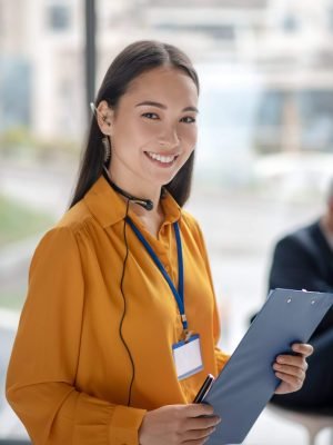young-pretty-asian-woman-with-a-badge-smiling-nice-2024-10-11-17-53-32-utc-scaled-1.jpg